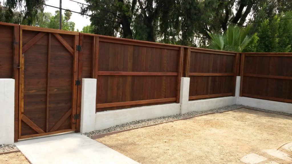 Custom Vertical + Horizontal Wood Fence & Gates over Concrete Curb